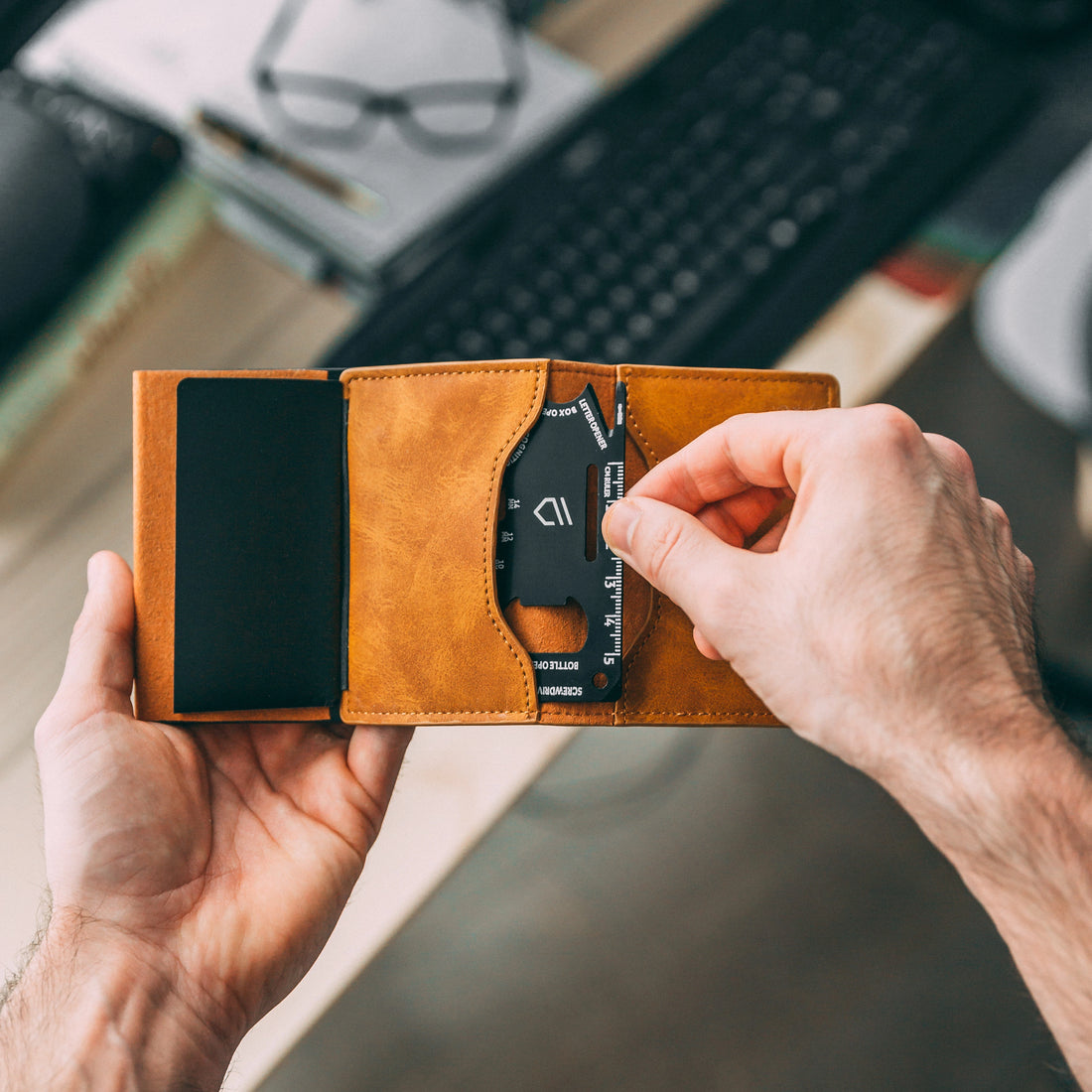 man holding FOSH wallet and tool card